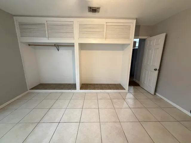 a view of an empty room with windows