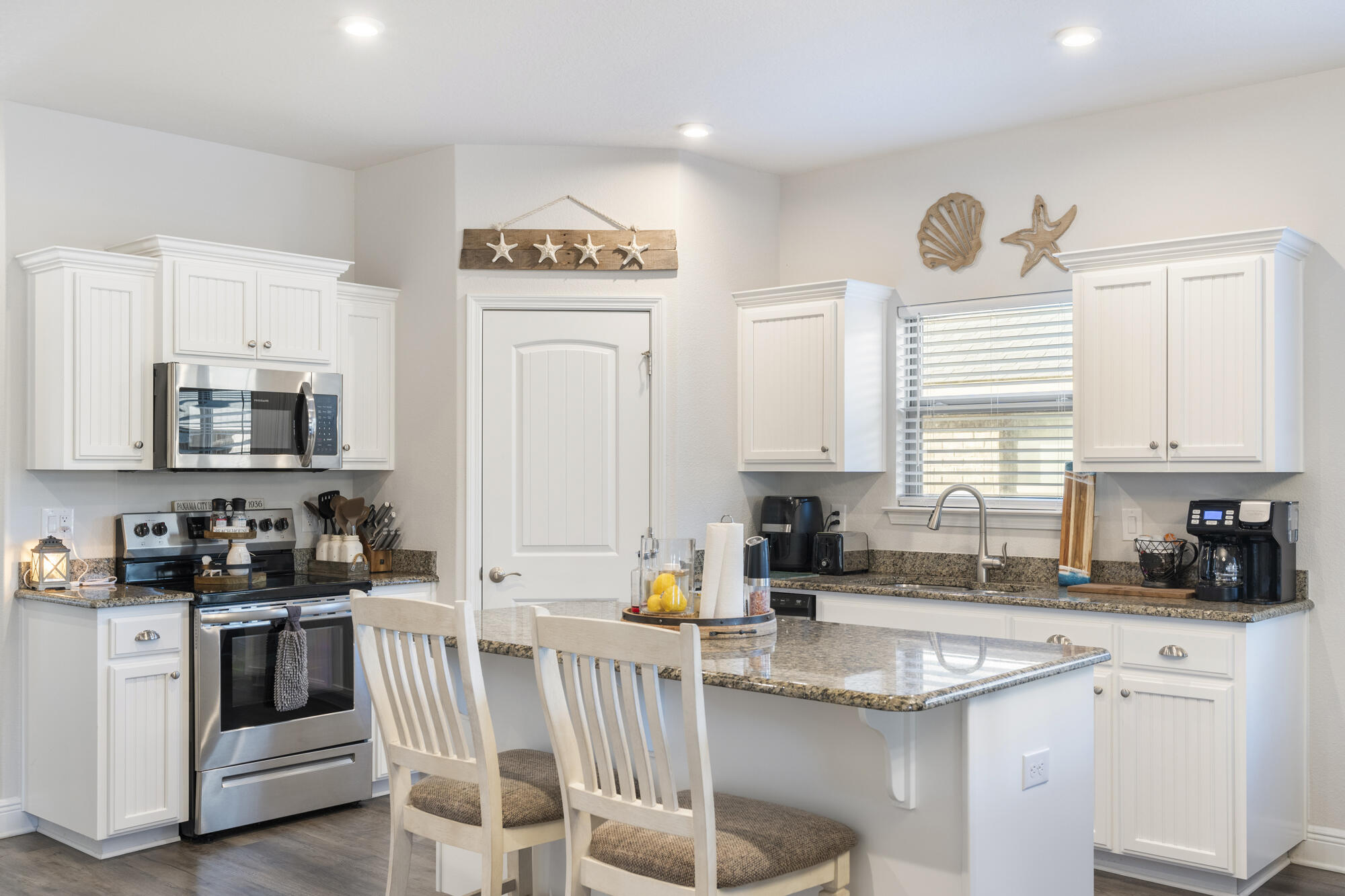 113 Ridgeway Circle Crestview, FL 32536 - Photo 11 of 54 a kitchen with white cabinets and sink