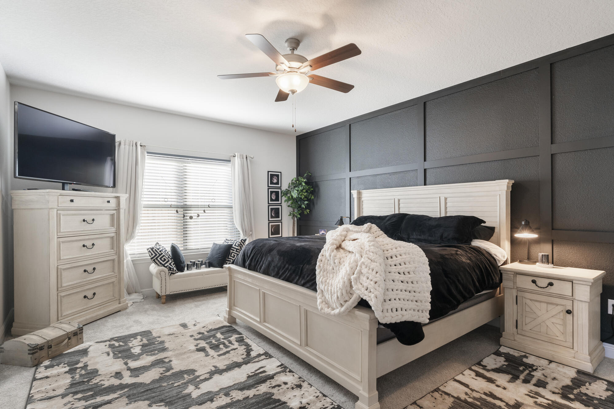 113 Ridgeway Circle Crestview, FL 32536 - Photo 20 of 54 a bedroom with a bed a couch and a flat screen tv