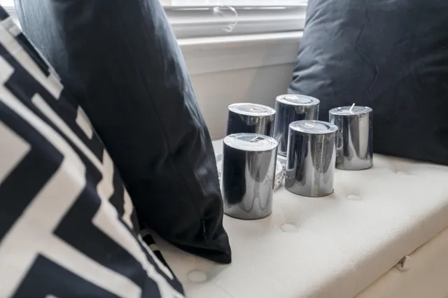 a white bath tub sitting next to a white sink and a mirror
