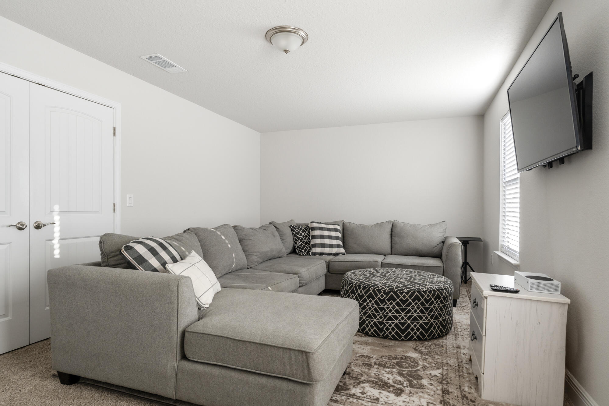 113 Ridgeway Circle Crestview, FL 32536 - Photo 29 of 54 a living room with furniture and a flat screen tv