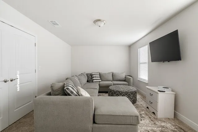 a living room with a couch and a table