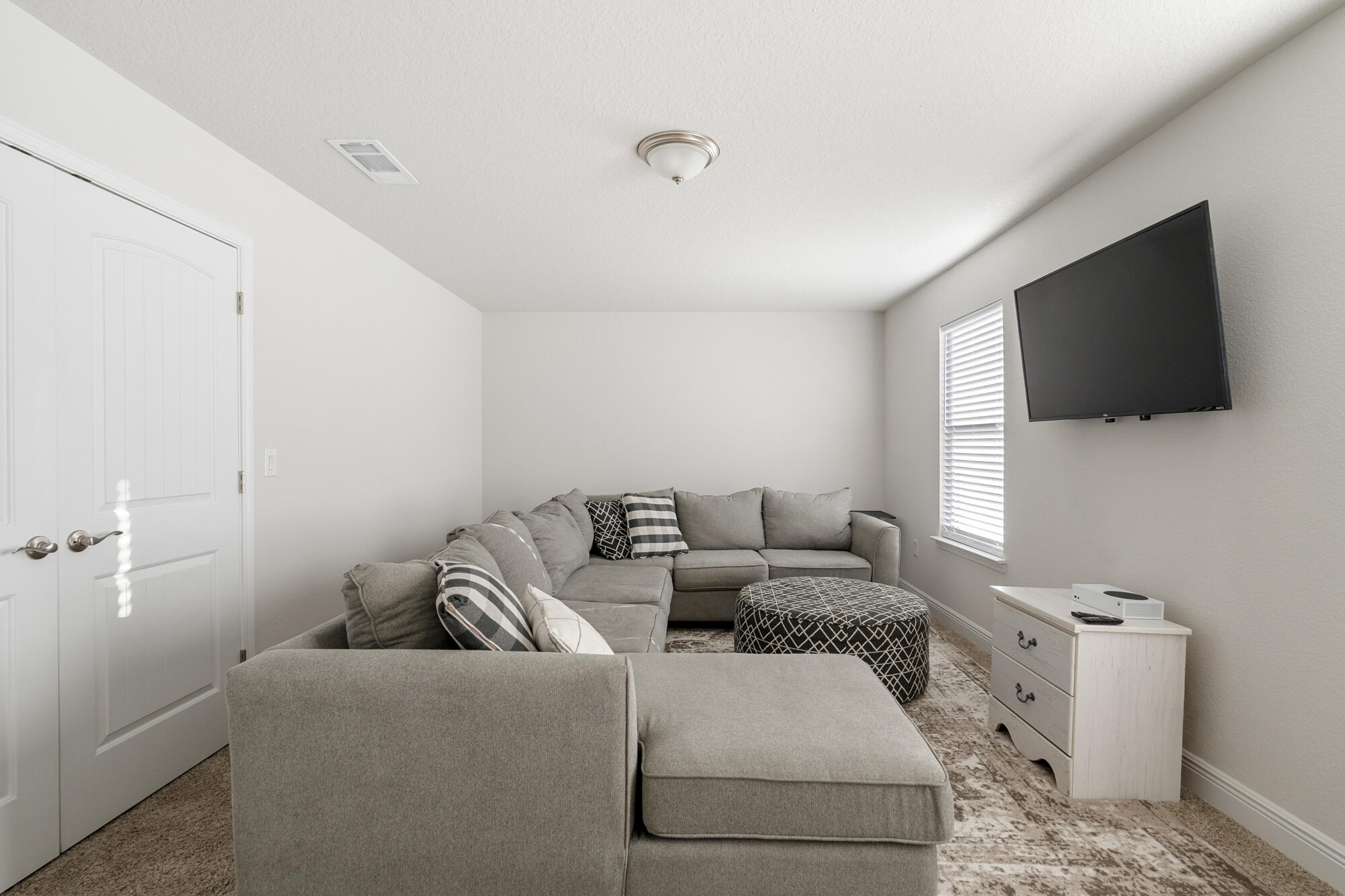 113 Ridgeway Circle Crestview, FL 32536 - Photo 30 of 54 a living room with furniture and a flat screen tv