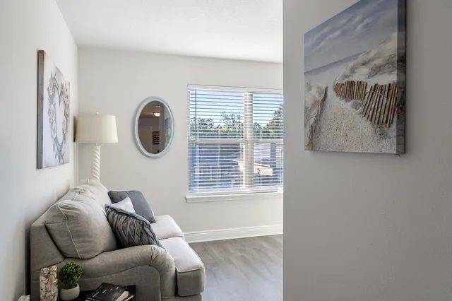 a view of workspace with wooden floor windows