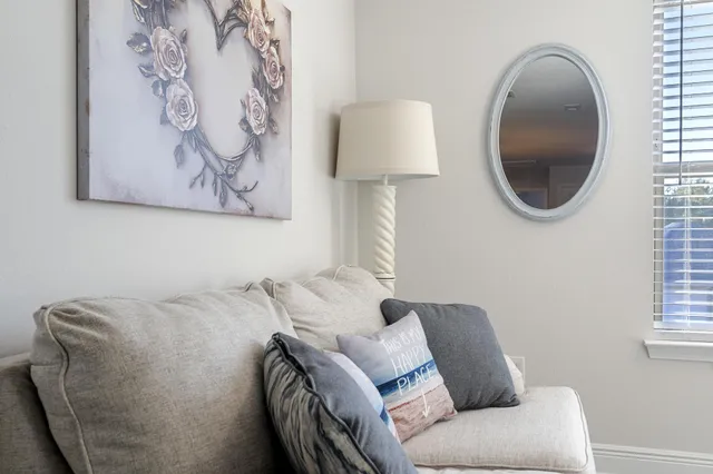 a bed room with a bed tv and a window