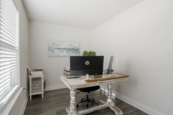 a bedroom with bed and a window