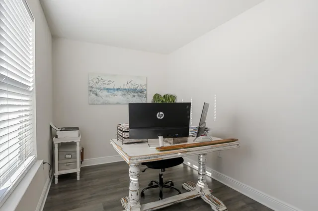 a bedroom with bed and a window