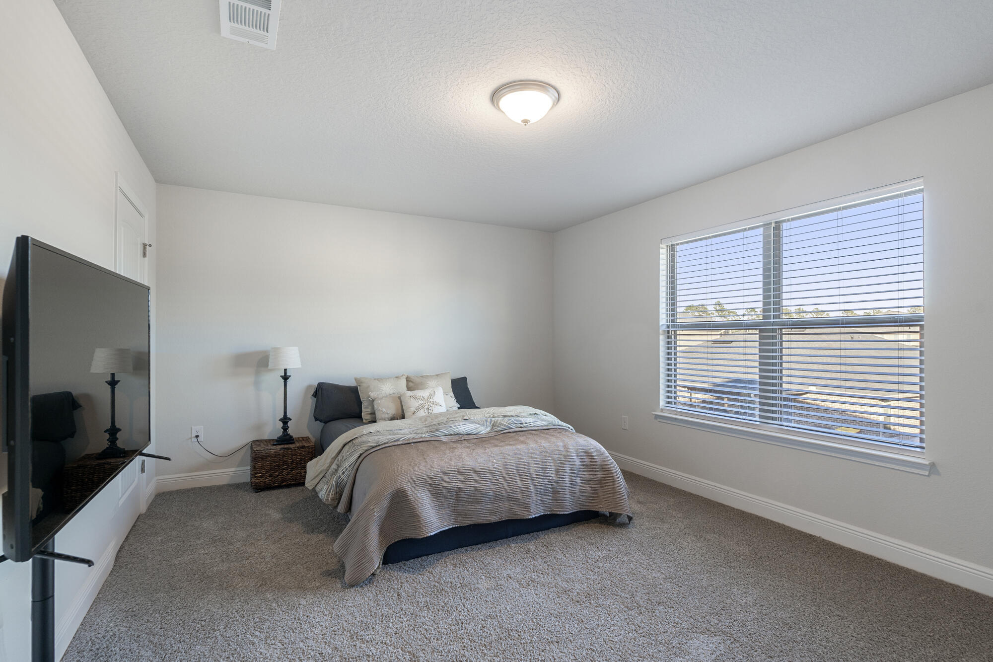 113 Ridgeway Circle Crestview, FL 32536 - Photo 36 of 54 a bed room with a bed tv and a window