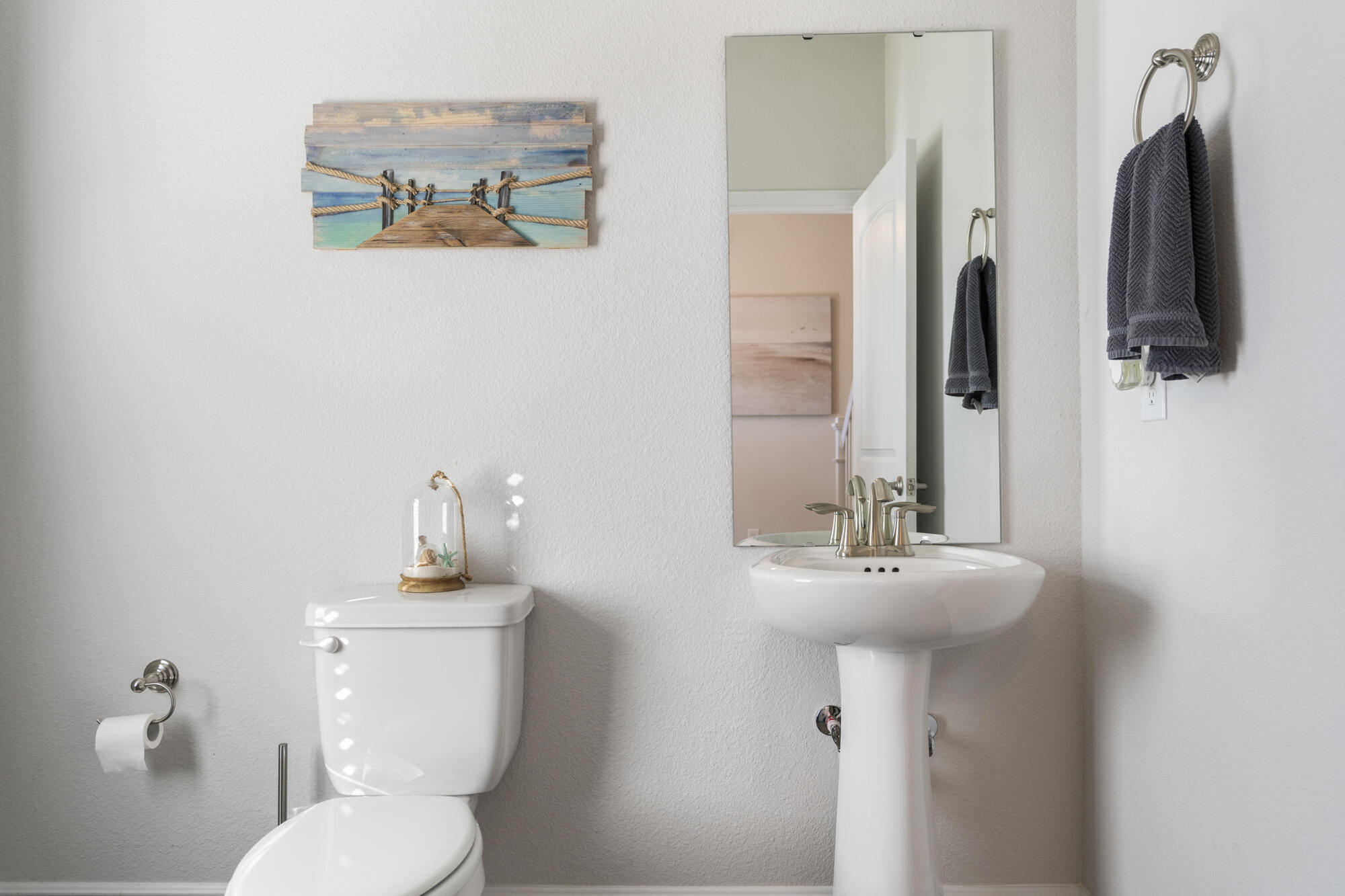 113 Ridgeway Circle Crestview, FL 32536 - Photo 41 of 54 a bathroom with a toilet sink and mirror