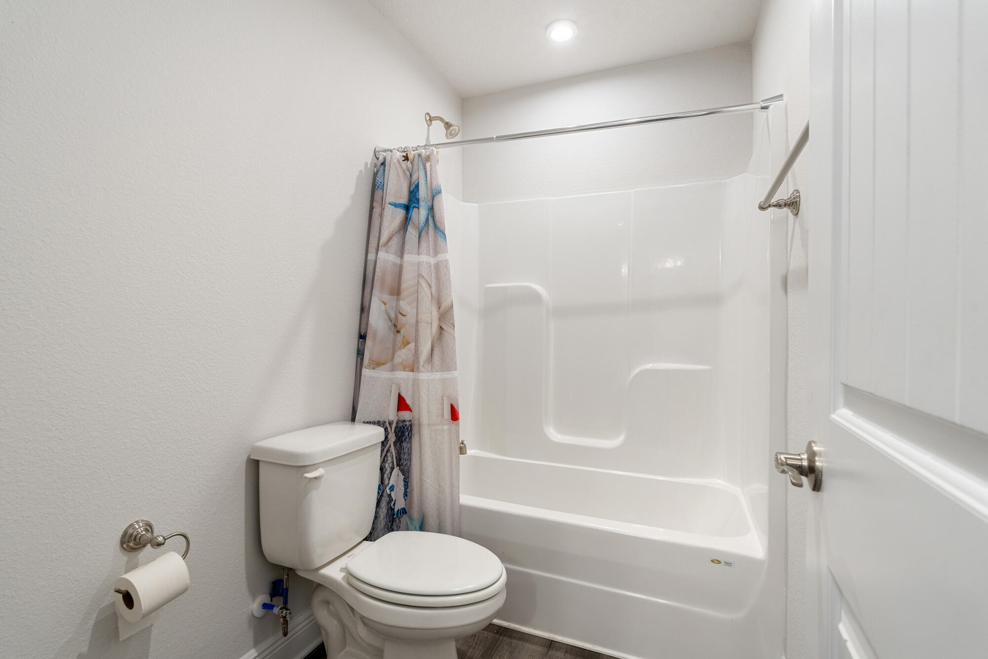 113 Ridgeway Circle Crestview, FL 32536 - Photo 44 of 54 a white toilet sitting next to a bath tub