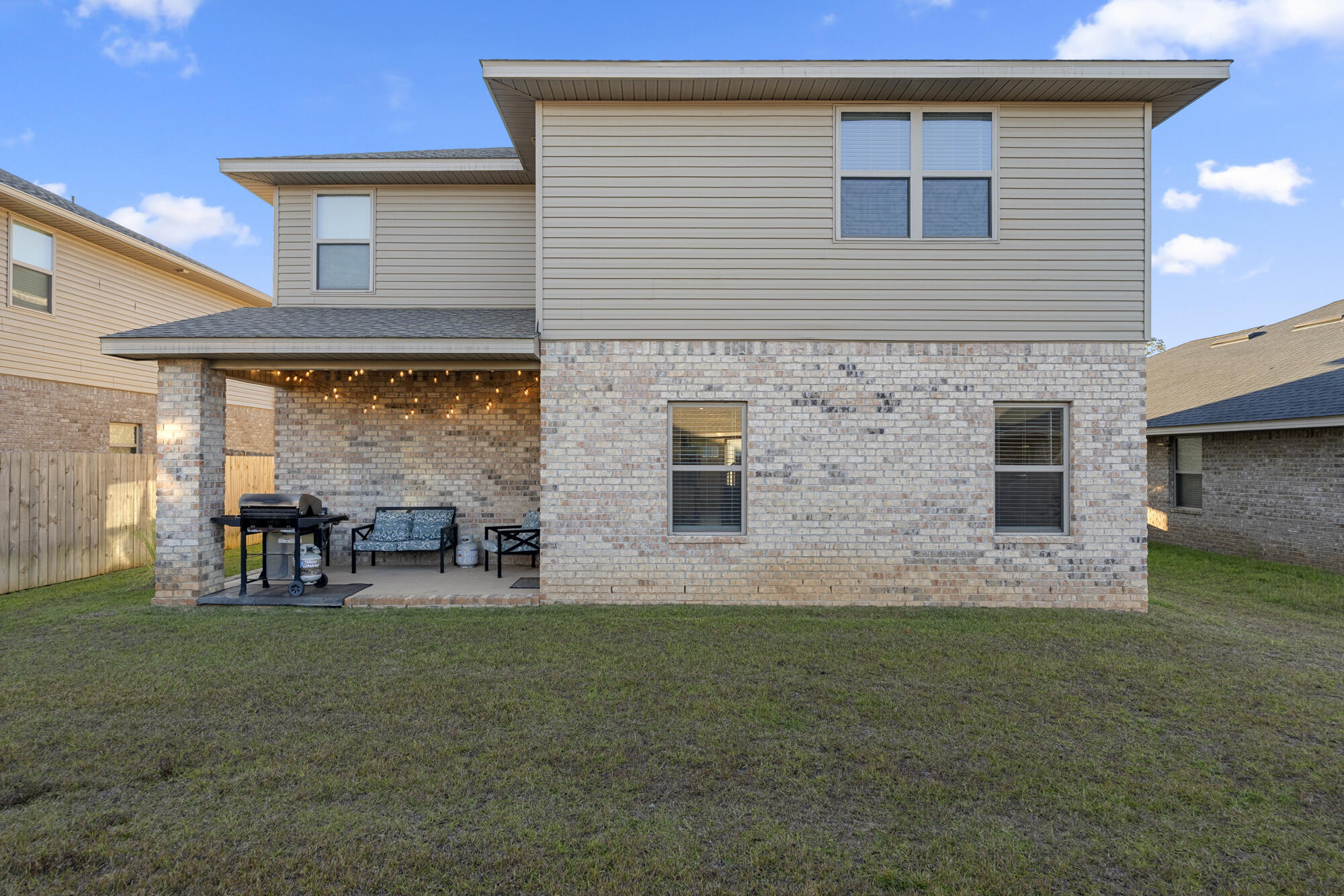 113 Ridgeway Circle Crestview, FL 32536 - Photo 49 of 54 a front view of house with outdoor seating and yard
