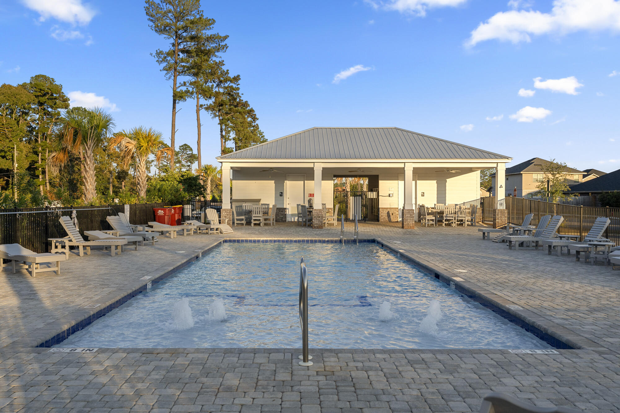 113 Ridgeway Circle Crestview, FL 32536 - Photo 54 of 54 a view of a patio with a table and chairs under an umbrella