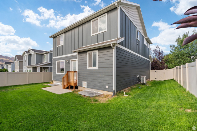7822 North Copperbend Road Eagle Mountain, UT 84005 - Photo 45 of 46 Expansive green lawn with a privacy fence