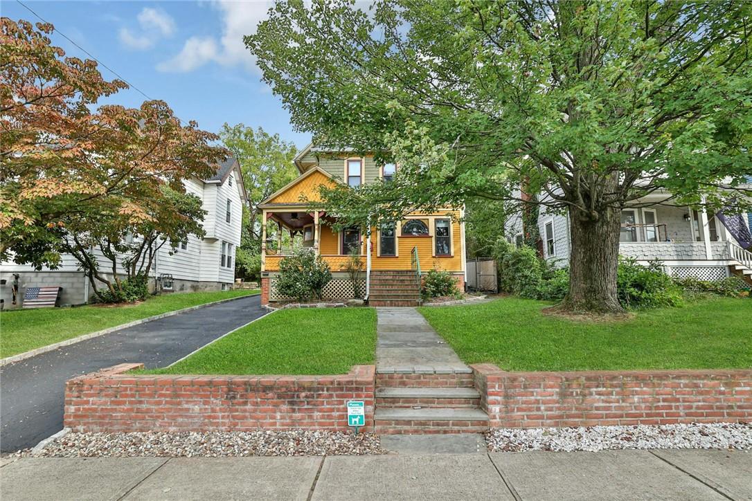 329 Smith Street Peekskill, NY 10566 - Photo 1 of 1 View of front of property featuring a front lawn and covered porch