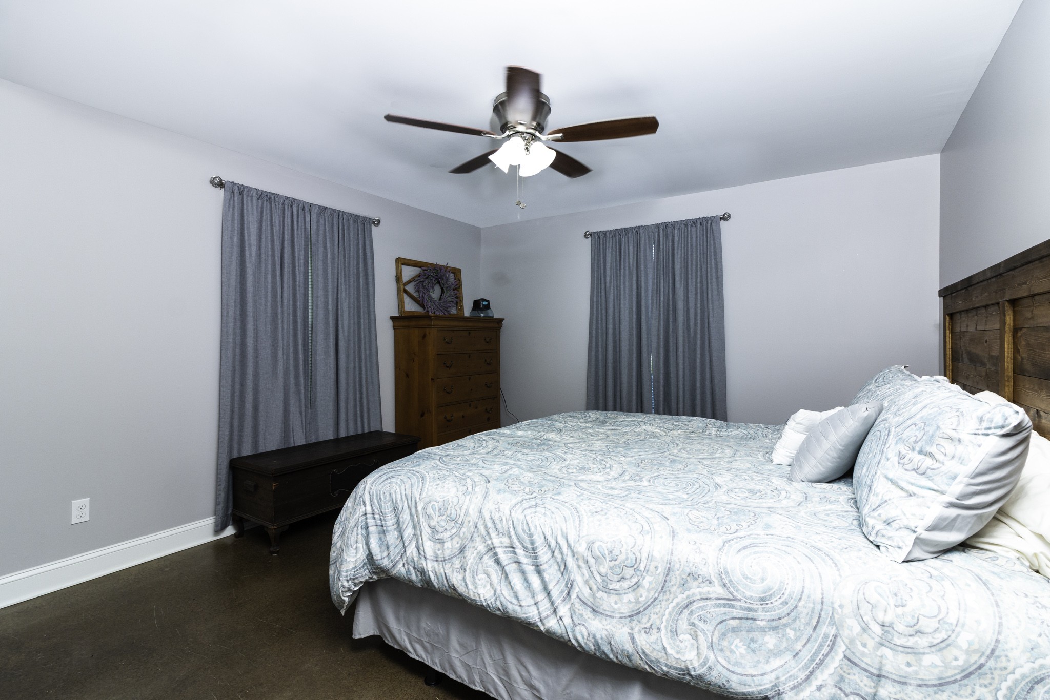 82 Railroad Road Westpoint, TN 38486 - Photo 11 of 30 a bedroom with a bed and a chandelier