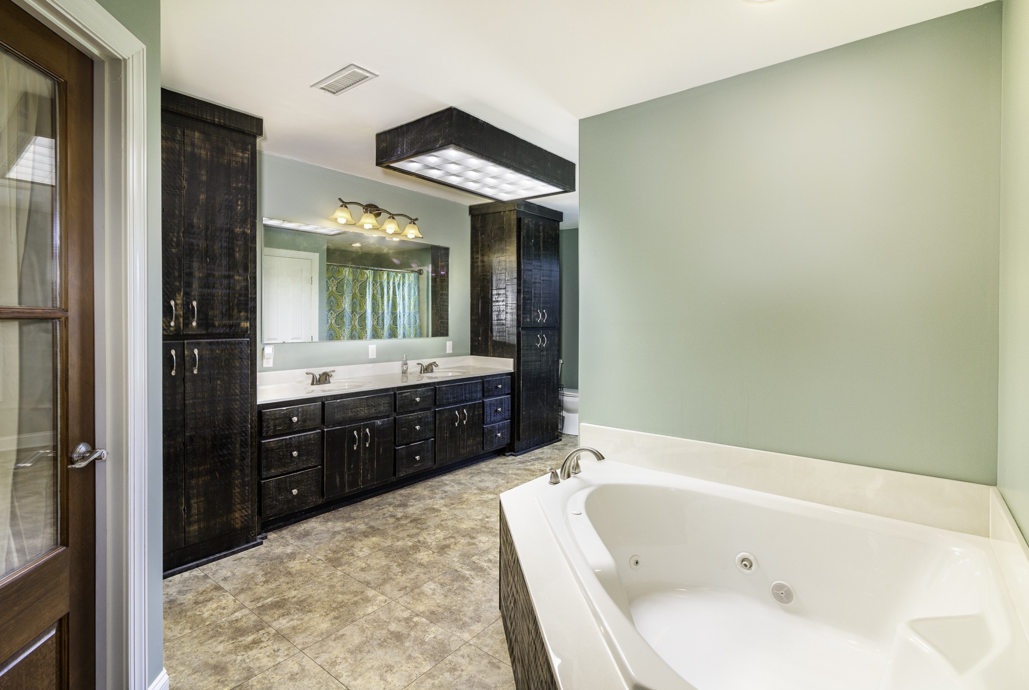 82 Railroad Road Westpoint, TN 38486 - Photo 15 of 30 a bathroom with a tub sink and mirror