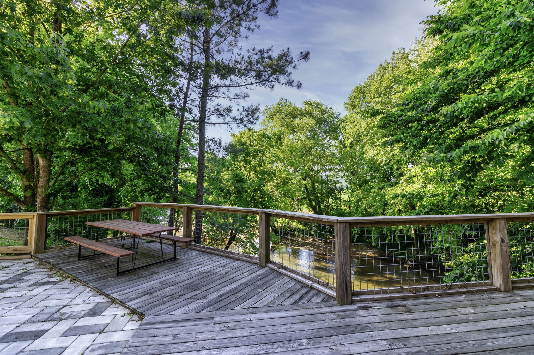 82 Railroad Road Westpoint, TN 38486 - Photo 21 of 30 a view of a roof deck with wooden floor and outdoor seating