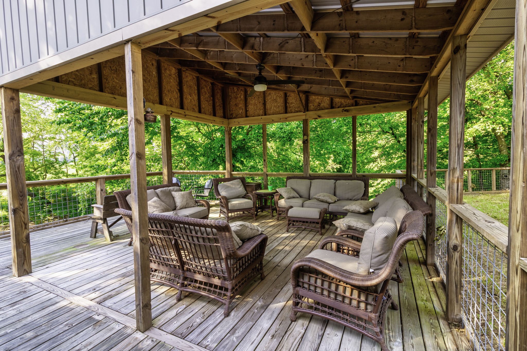 82 Railroad Road Westpoint, TN 38486 - Photo 22 of 30 a view of a patio with table and chairs and wooden floor