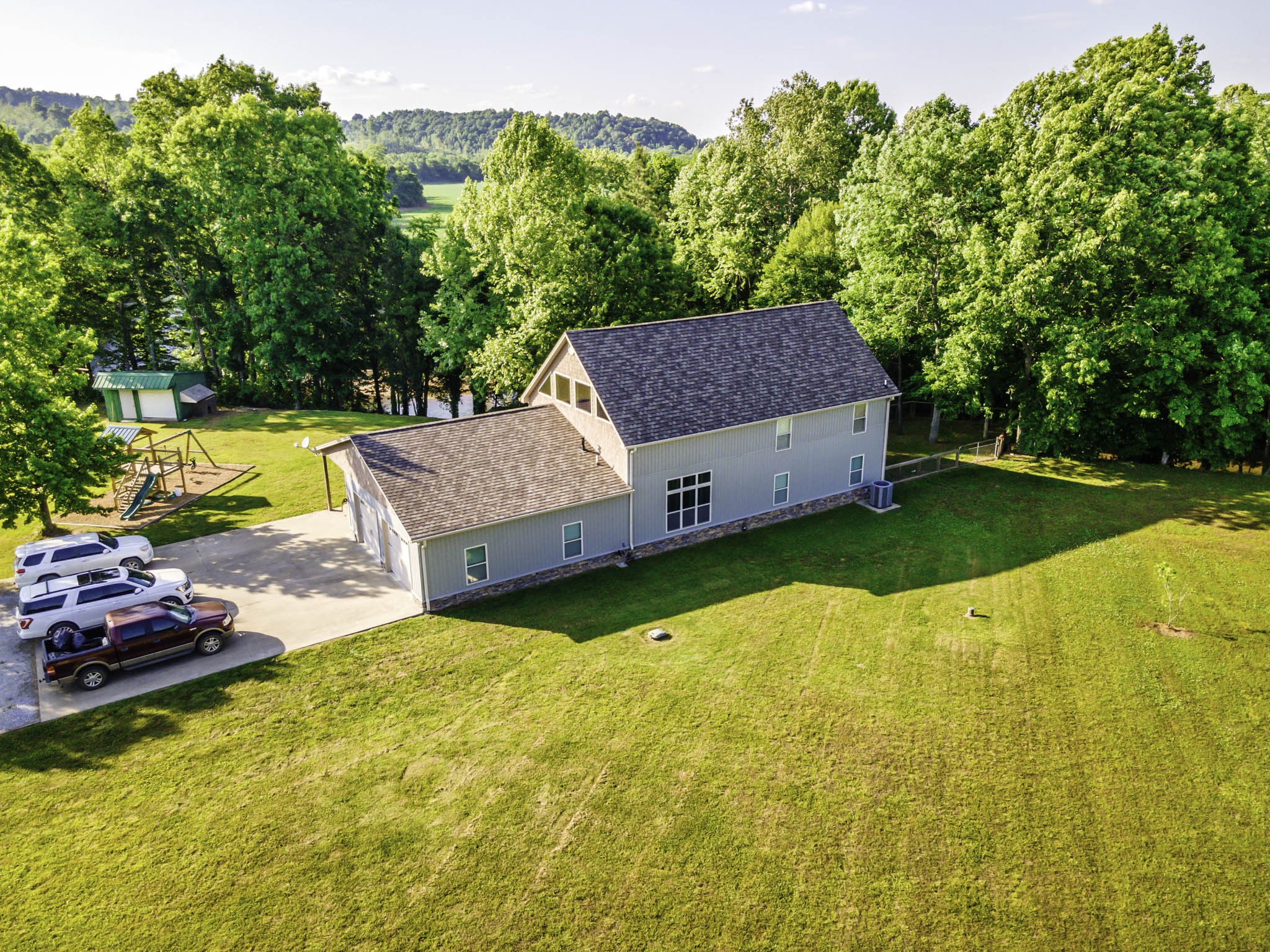 82 Railroad Road Westpoint, TN 38486 - Photo 28 of 30 a view of a house with swimming pool and a yard