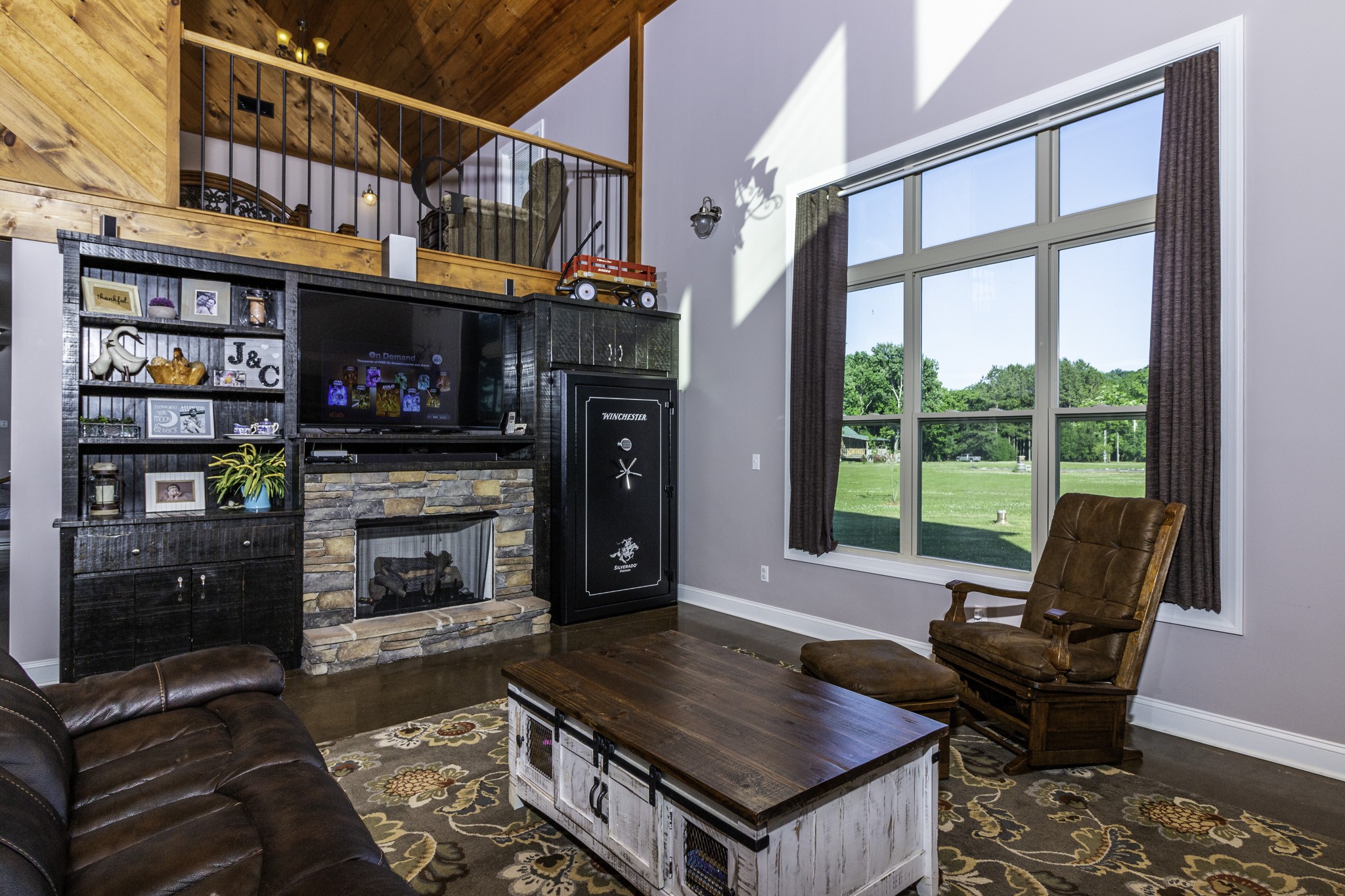 82 Railroad Road Westpoint, TN 38486 - Photo 4 of 30 a living room with furniture a fireplace and a floor to ceiling window