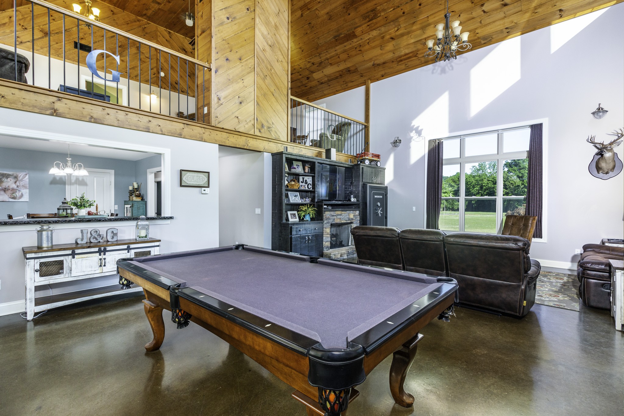 82 Railroad Road Westpoint, TN 38486 - Photo 5 of 30 a living room with a table chairs and kitchen view