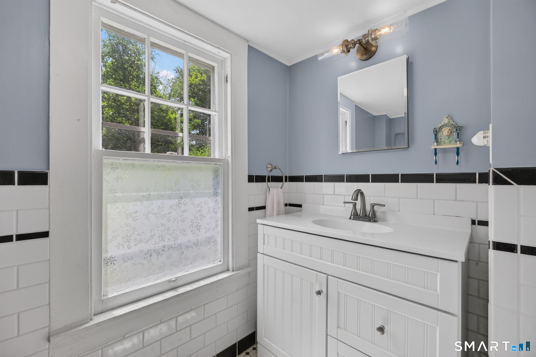 79 River Street Deep River, CT 06417 - Photo 25 of 40 a bathroom with a sink and a mirror