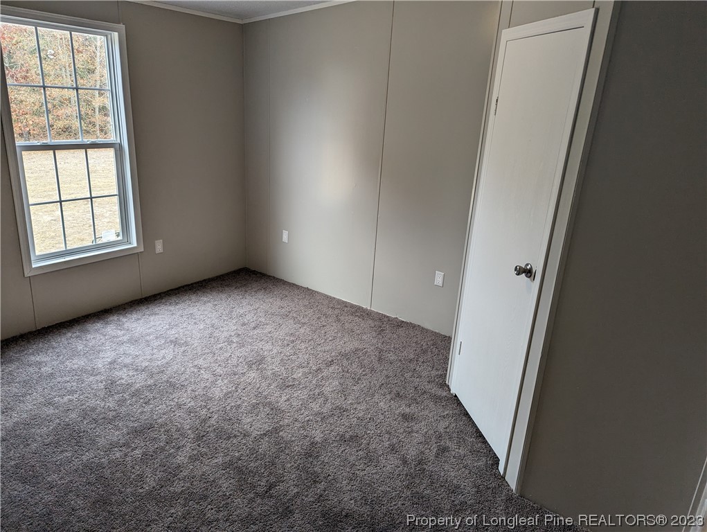 271 Eisler Drive Lillington, NC 27546 - Photo 12 of 17 an empty room with windows