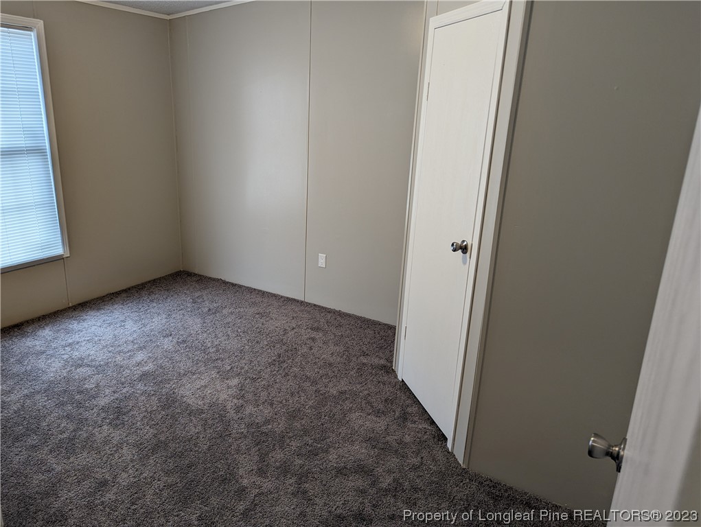 271 Eisler Drive Lillington, NC 27546 - Photo 15 of 17 an empty room with windows