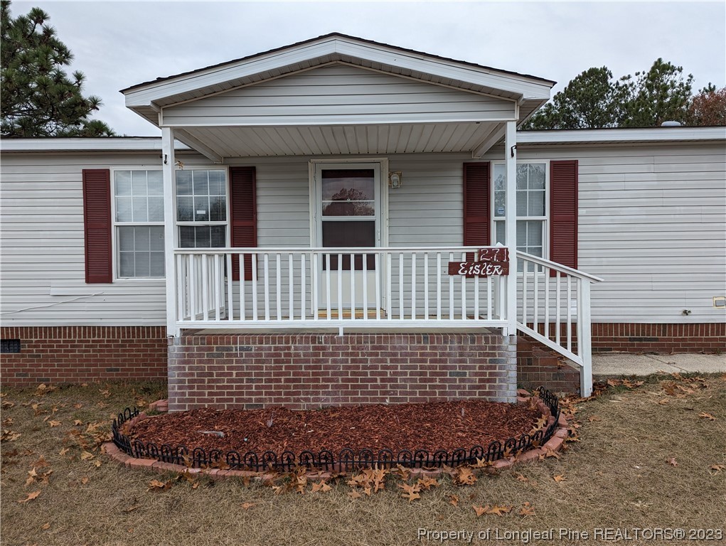 271 Eisler Drive Lillington, NC 27546 - Photo 2 of 17 a front view of a house with a yard