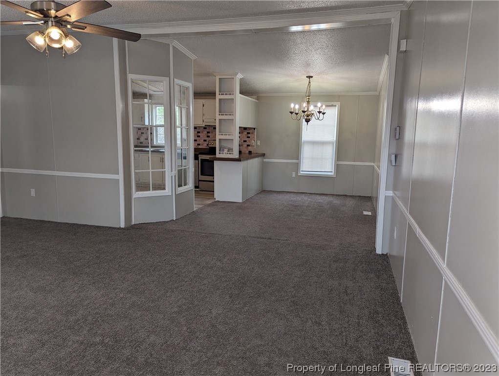 271 Eisler Drive Lillington, NC 27546 - Photo 4 of 17 a view of a hallway with a chandelier
