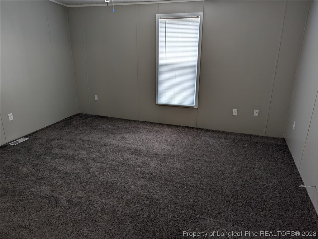 271 Eisler Drive Lillington, NC 27546 - Photo 8 of 17 an empty room with a window