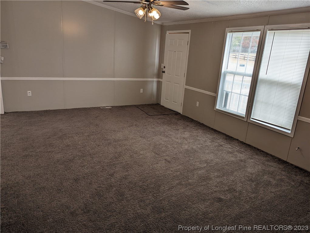 271 Eisler Drive Lillington, NC 27546 - Photo 10 of 17 wooden floor in an empty room with a window