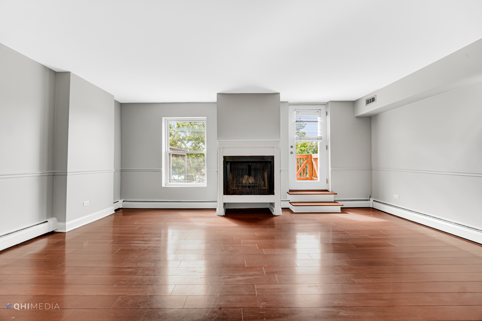 1750 North Wells Street, Unit 403 Chicago, IL 60614 - Photo 15 of 20 an empty room with floor to ceiling window and fireplace