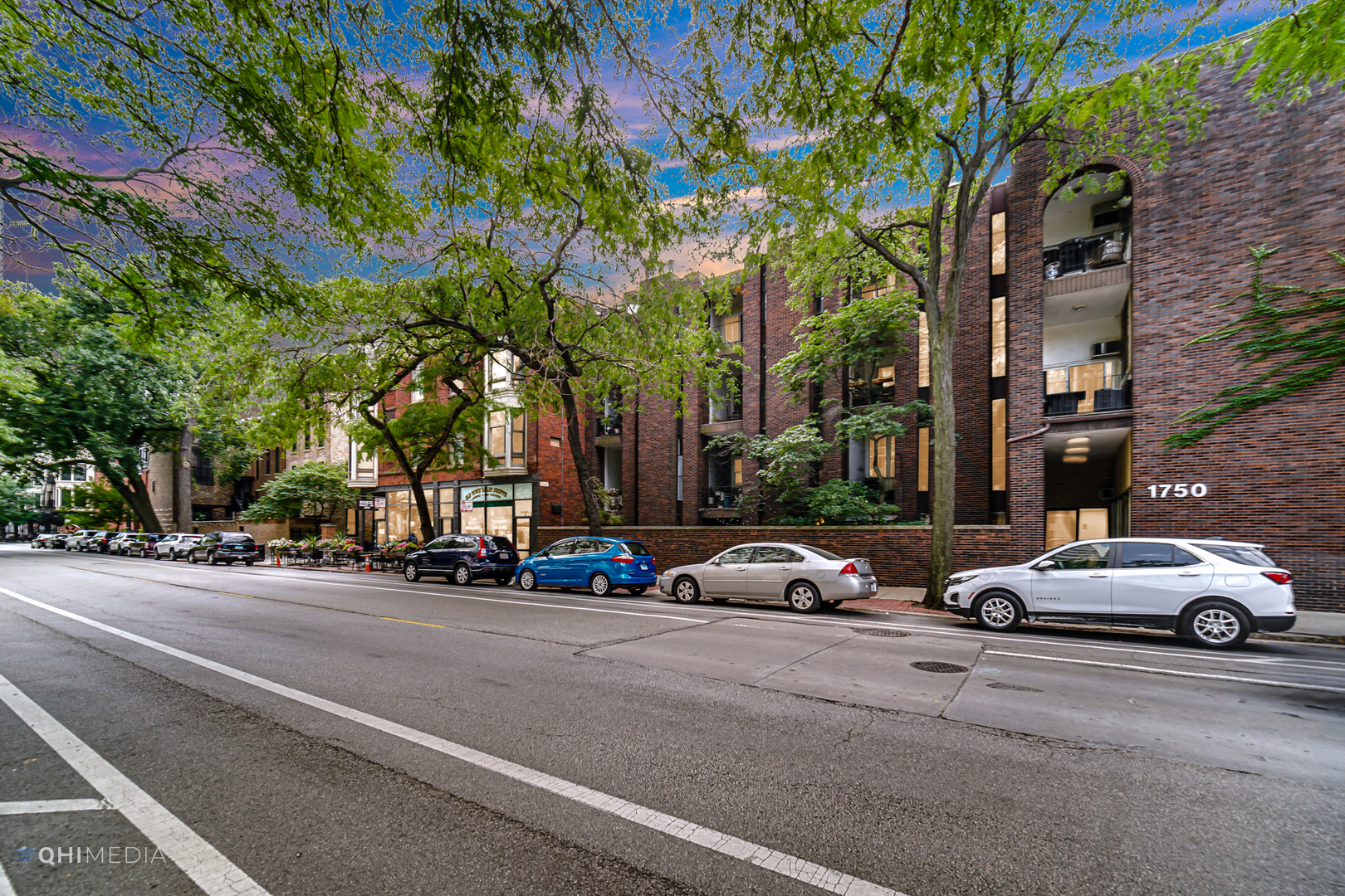 1750 North Wells Street, Unit 403 Chicago, IL 60614 - Photo 20 of 20 a building with trees in front of it