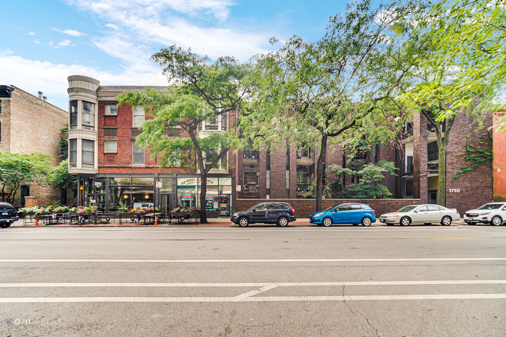 1750 North Wells Street, Unit 403 Chicago, IL 60614 - Photo 2 of 20 a view of street with cars