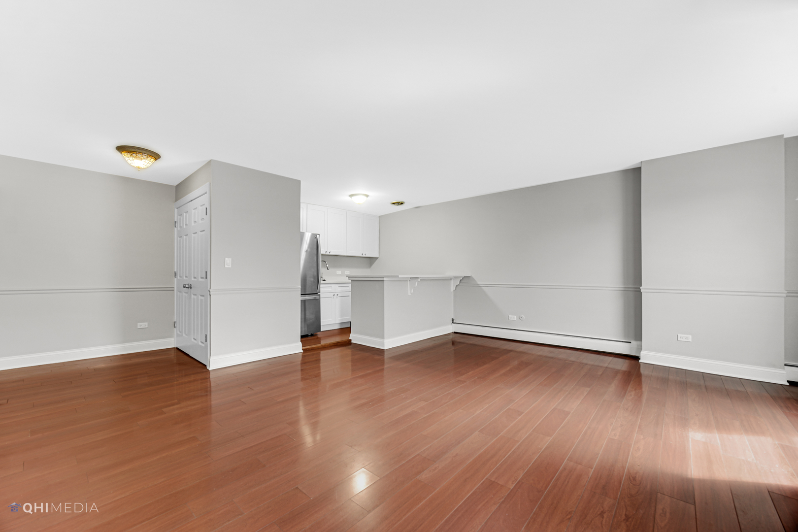 1750 North Wells Street, Unit 403 Chicago, IL 60614 - Photo 5 of 20 a view of an empty room with wooden floor