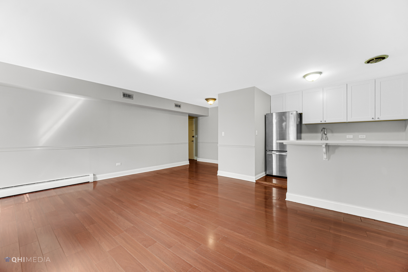 1750 North Wells Street, Unit 403 Chicago, IL 60614 - Photo 6 of 20 a view of empty room with wooden floor