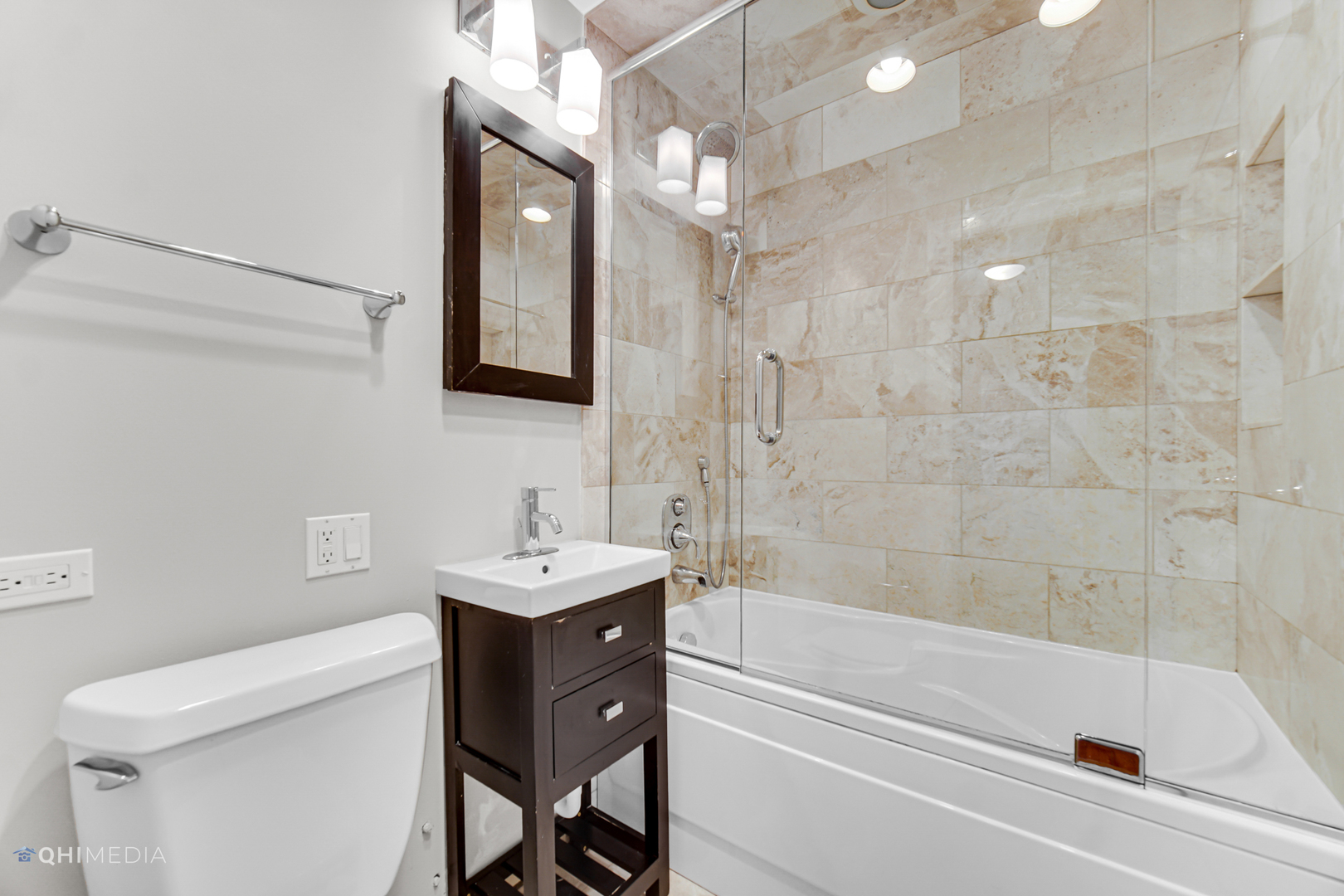 1750 North Wells Street, Unit 403 Chicago, IL 60614 - Photo 9 of 20 a bathroom with a sink a toilet and shower