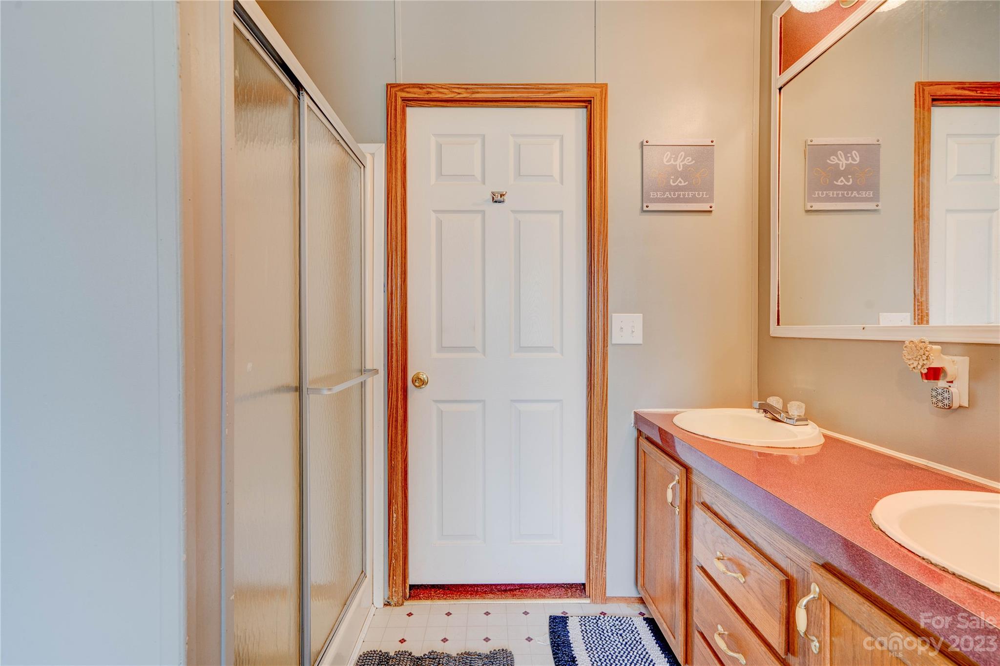 389 Shires Road Ellenboro, NC 28040 - Photo 17 of 30 a bathroom with a sink and a mirror