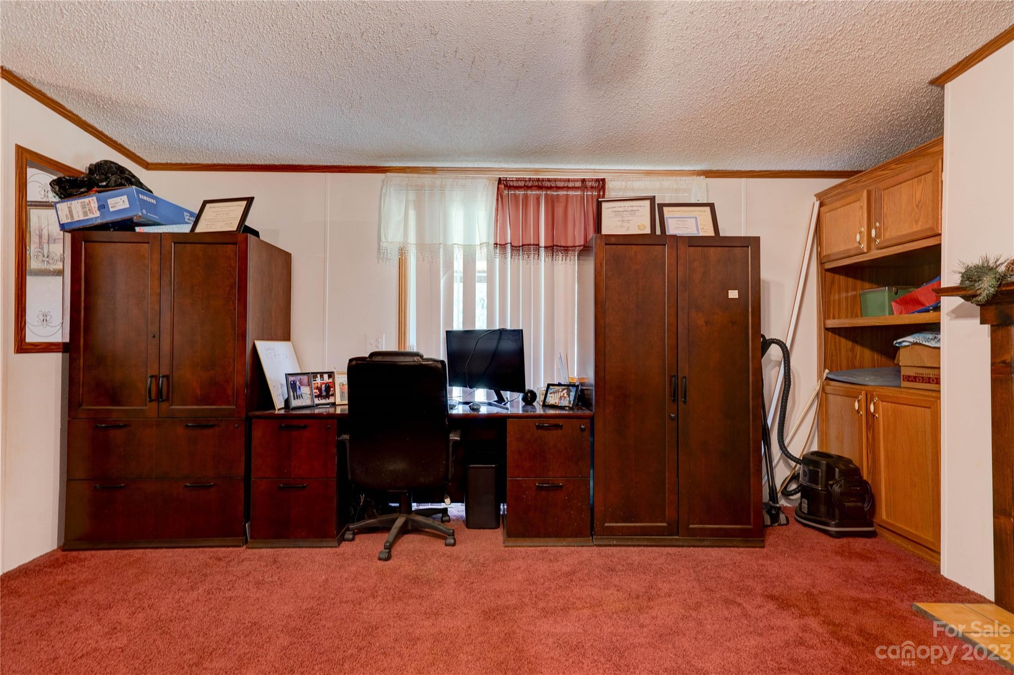 389 Shires Road Ellenboro, NC 28040 - Photo 19 of 30 a view of a workspace with furniture and a window