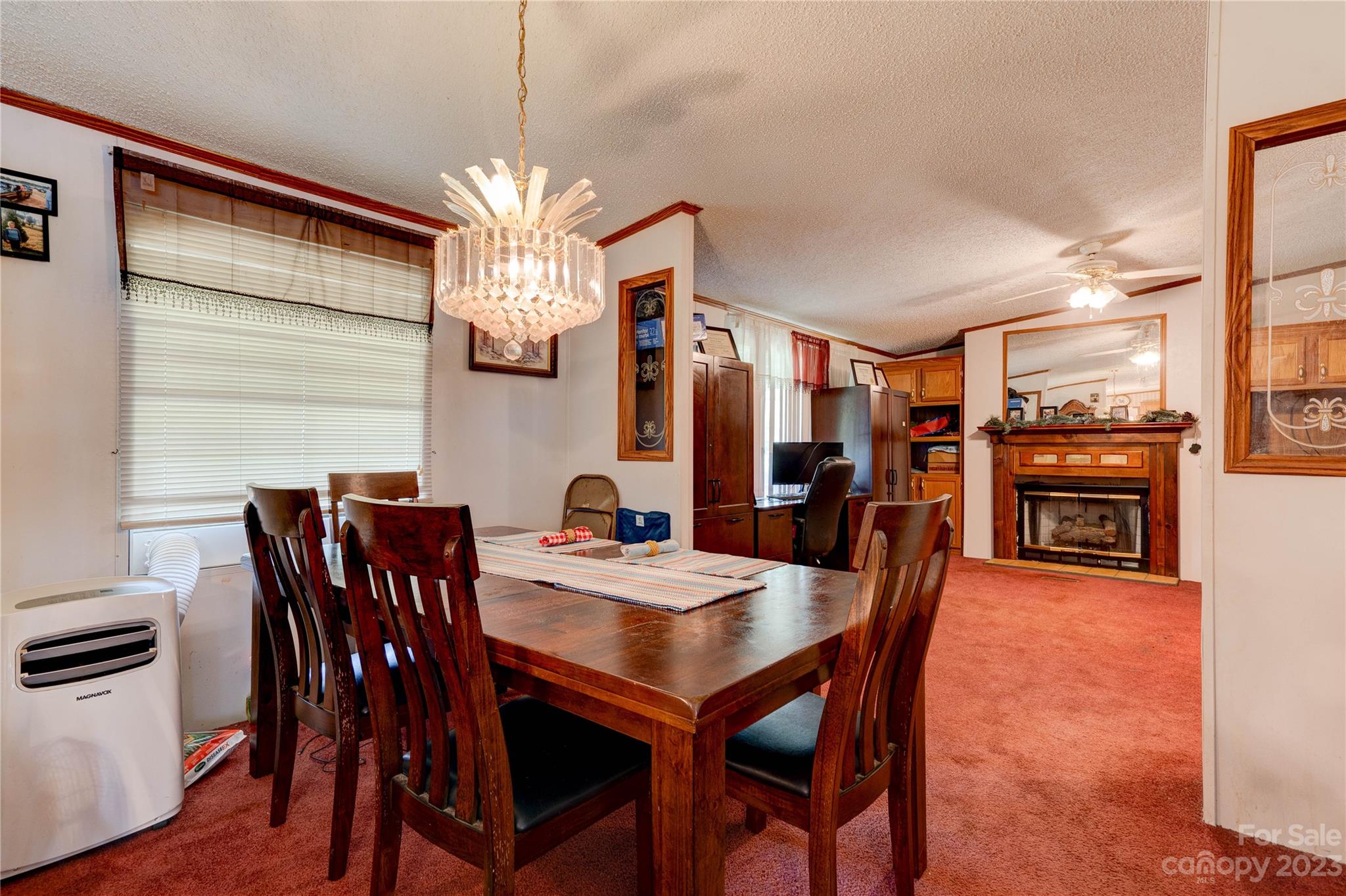 389 Shires Road Ellenboro, NC 28040 - Photo 20 of 30 a view of a dining room with furniture window and wooden floor