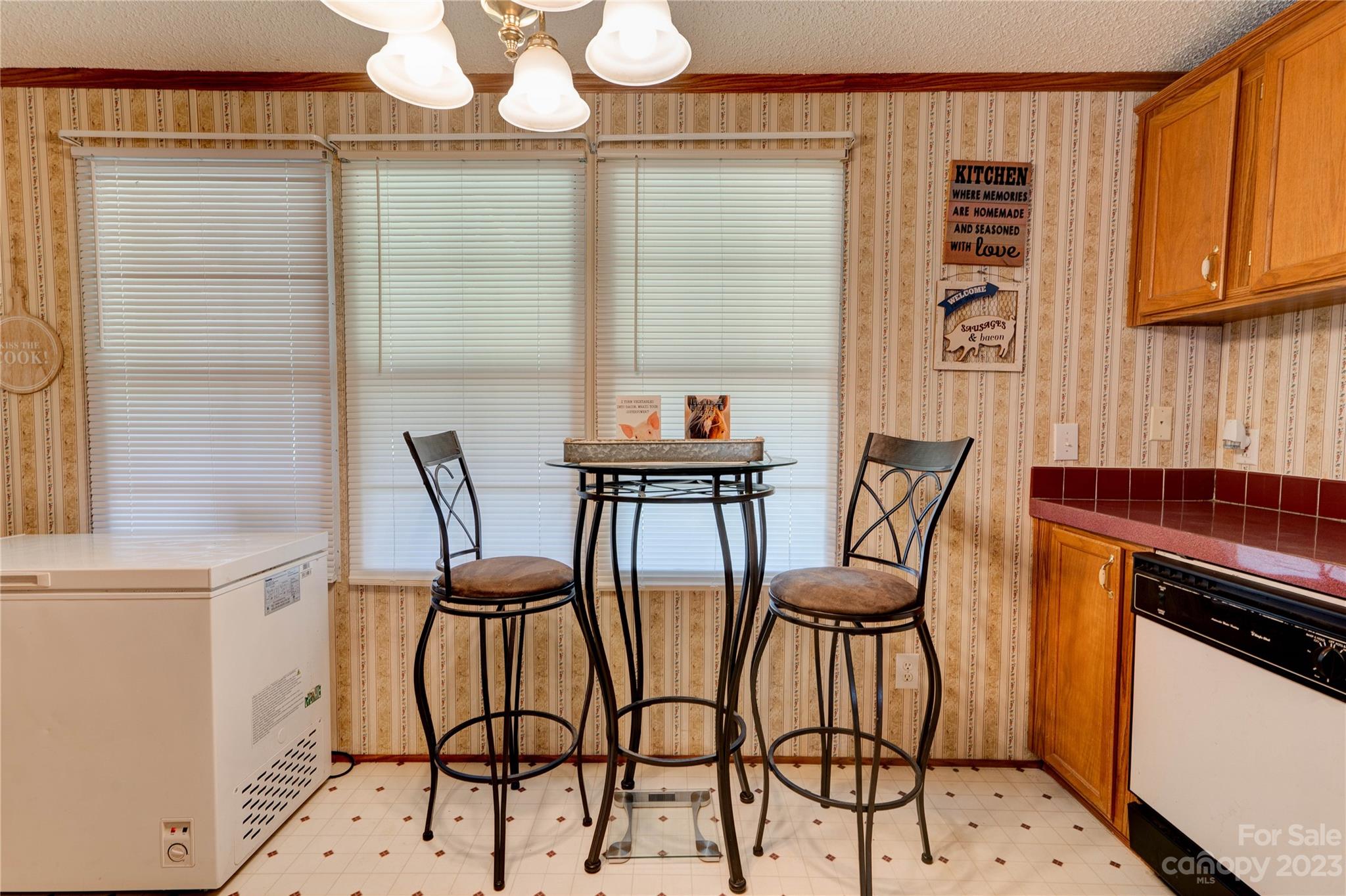 389 Shires Road Ellenboro, NC 28040 - Photo 23 of 30 a view of a dining room with furniture and chandelier