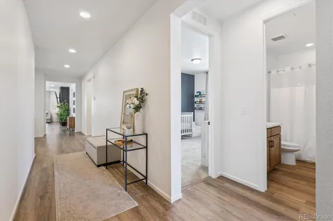 a view of a hallway and dining room