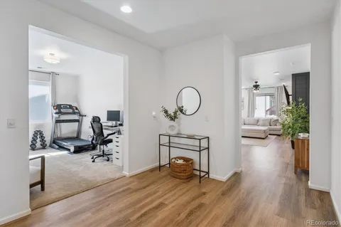 a view of a livingroom with furniture and a wooden floor