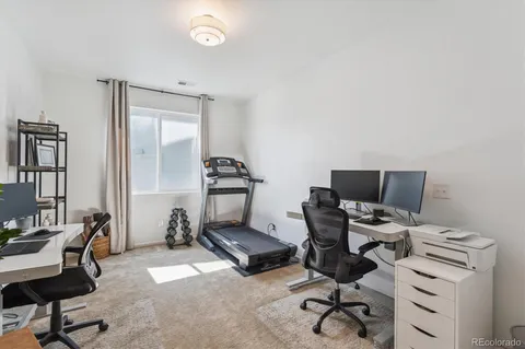a workspace with furniture and bathroom