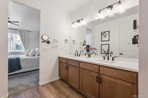 a en suite bathroom with a double vanity sink mirror and