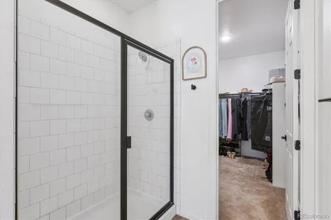 a view of a walk in closet and bathroom