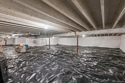 a view of a patio with table and chairs