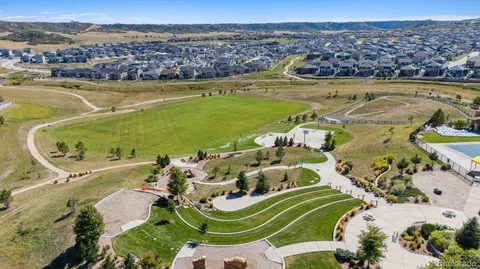 an aerial view of residential houses with outdoor space