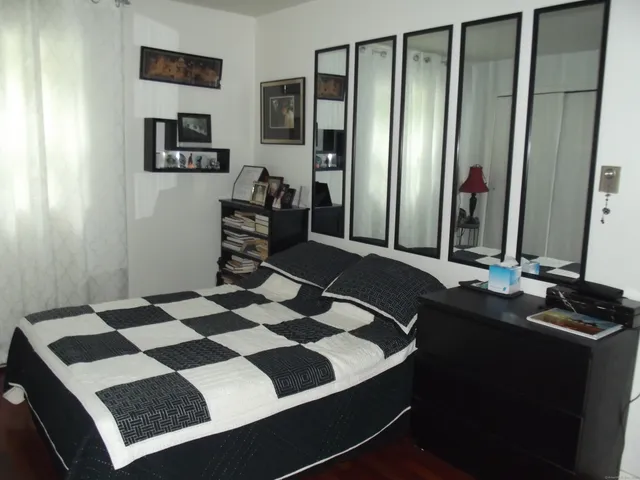 a bedroom with a bed and a walk in closet